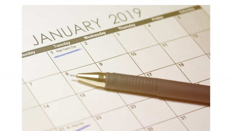 New Year's Day 2019 on calendar. Pen and calendar january 2019, with drawn text New Year's Day.