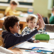 Child getting a high-five from their teacher
