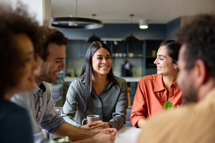 People smiling, while having a conversation